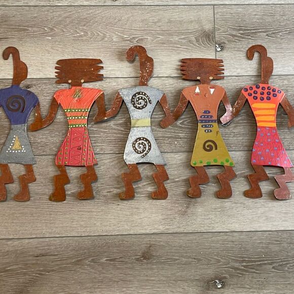 Feminist Five metal wall hanging.